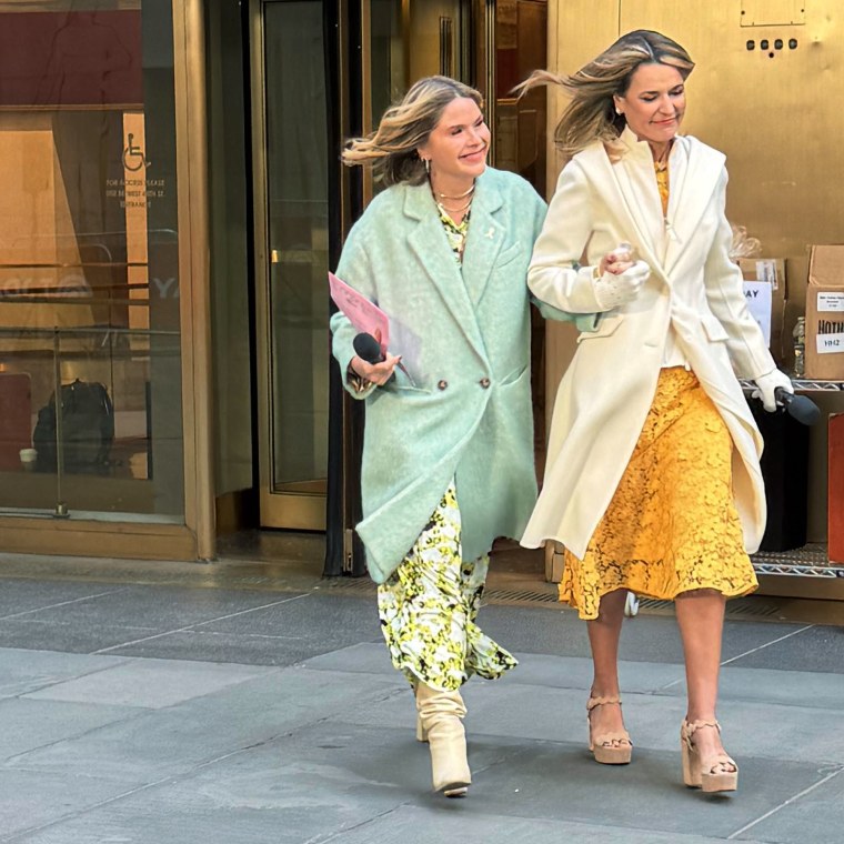 Savannah Guthrie, right, walks with Jenna Hager Bush outside the "TODAY" studios.
